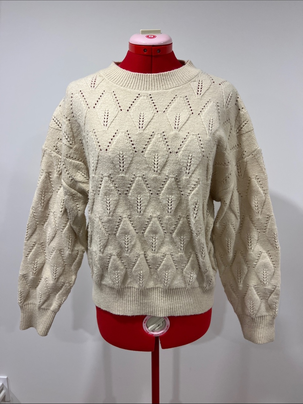 Cream cable-knit sweater